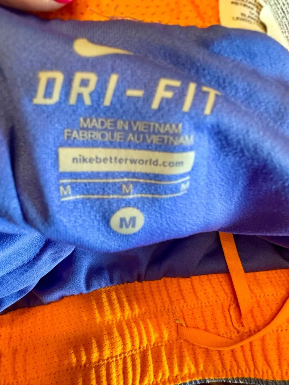 Nike Dri Fit Women’s Blue Splatter Running Shorts with Orange Side Panels M‎